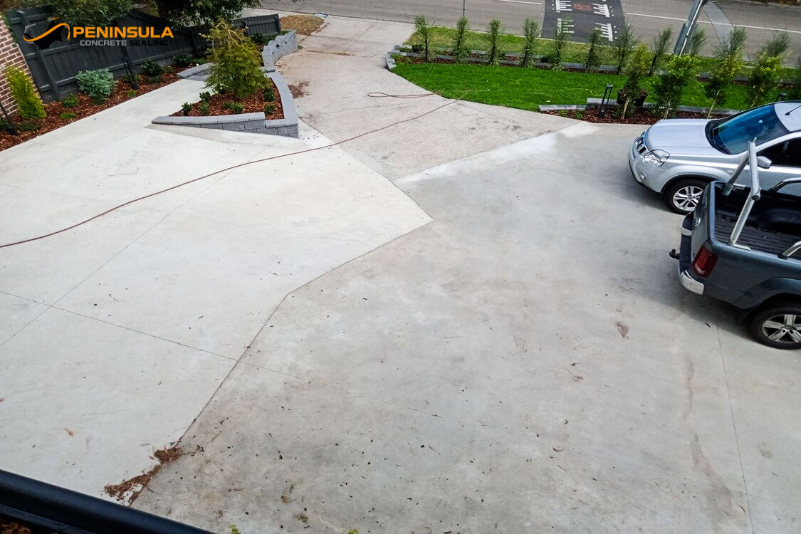 Raw concrete driveway sections ready for painting and sealing