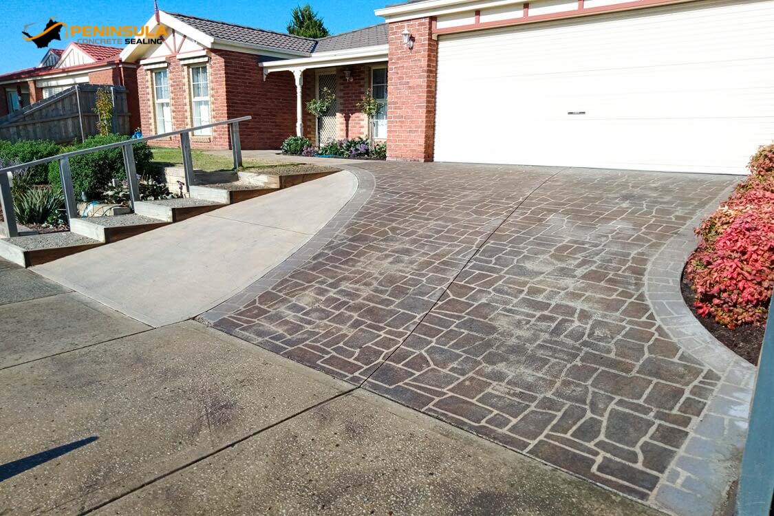 Stipple and stenciled concrete driveway before sealing and painting