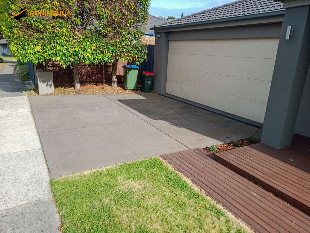 Raw oxide concrete driveway before driveway sealing
